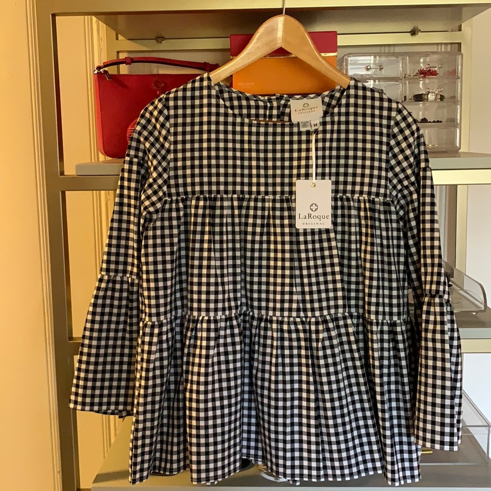 Black and white checkered top, layered with ruffle sleeves, buttons in back